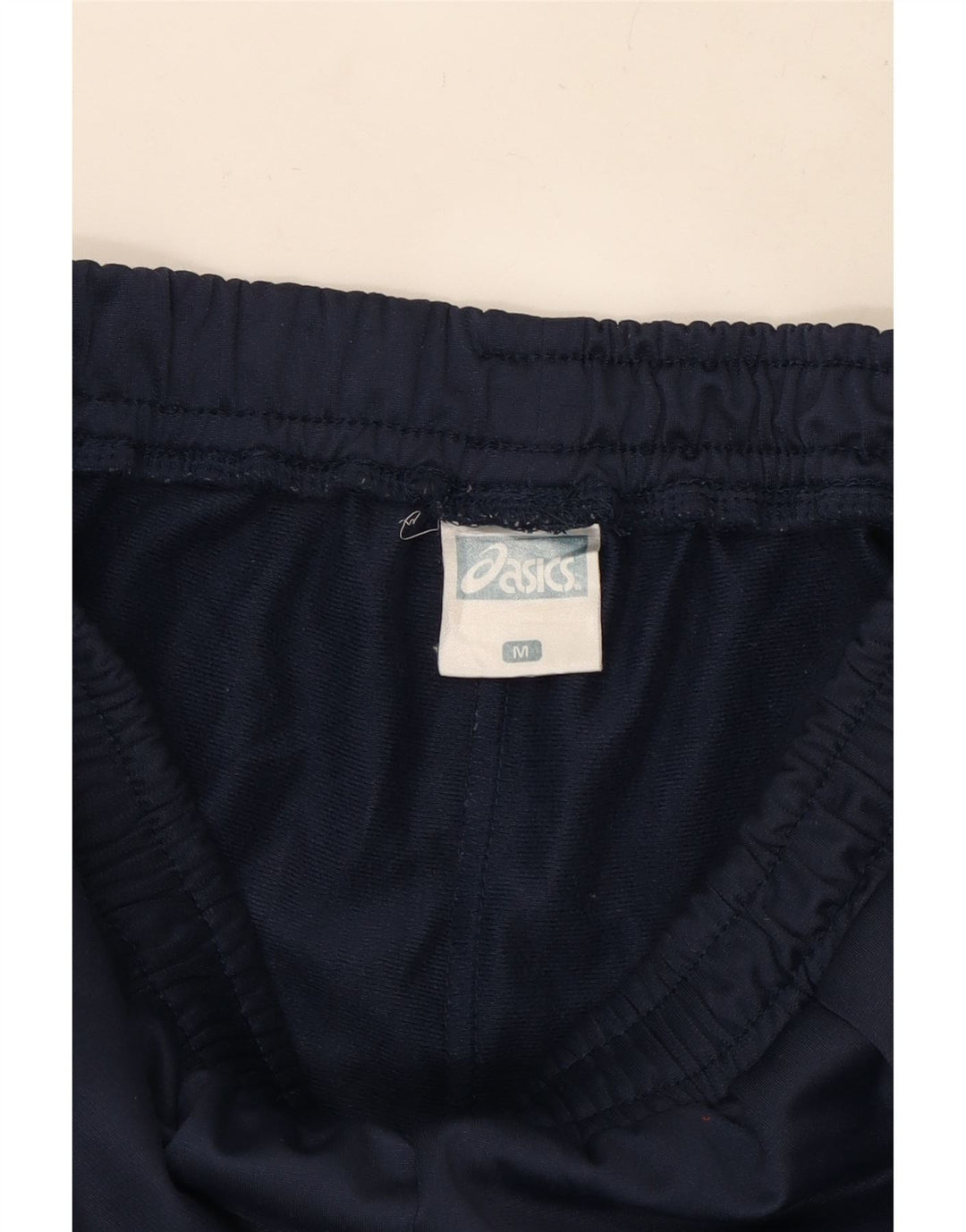 ASICS Pantalon de Survêtement Graphique Homme Bleu Marine Moyen Polyester