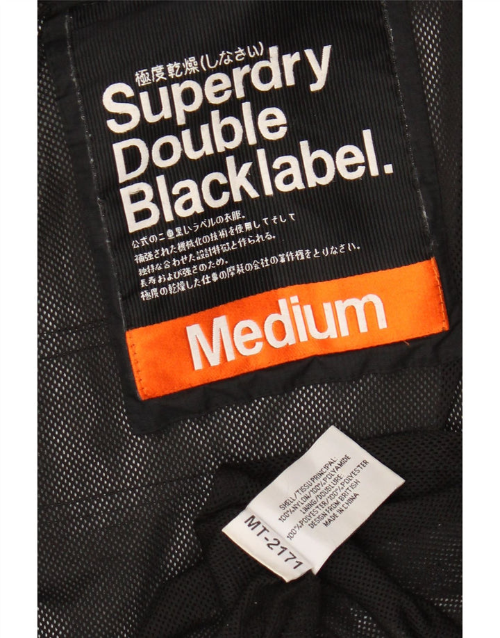 SUPERDRY Veste de pluie graphique pour femme UK 14 Medium Black Nylon