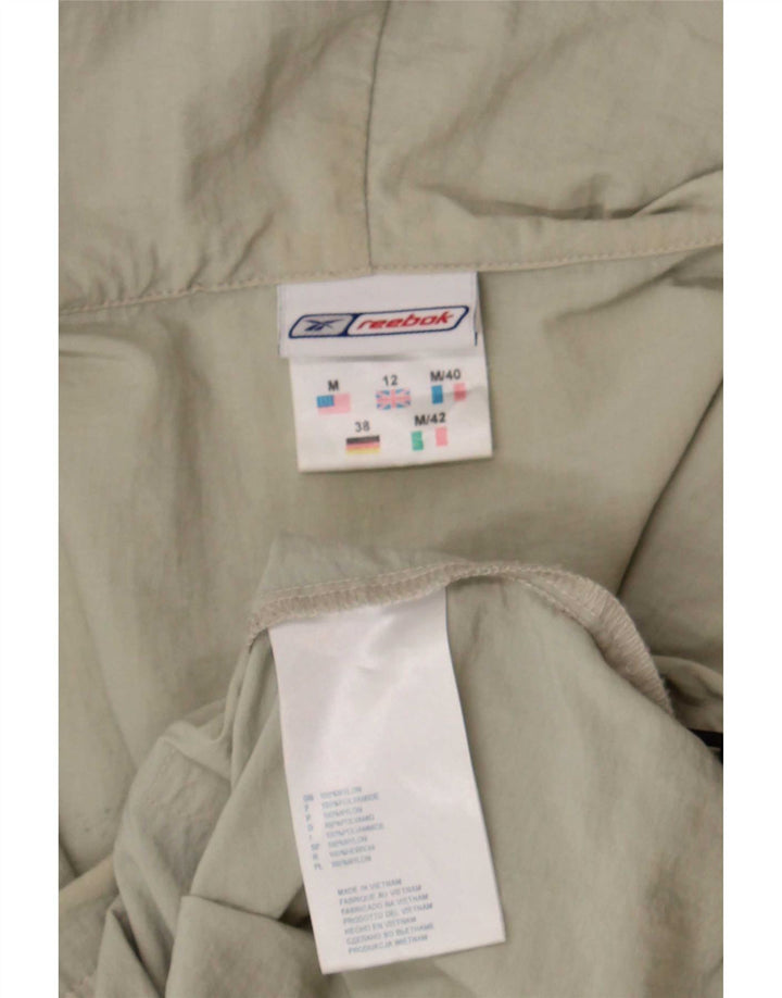 Reebok Veste de pluie à capuche pour femme UK 12 Nylon beige moyen