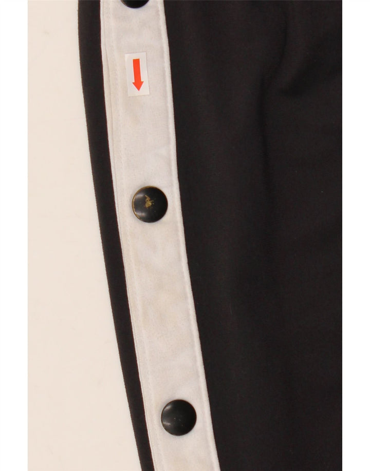 Pantalon de survêtement Nike pour homme en polyester color block noir moyen