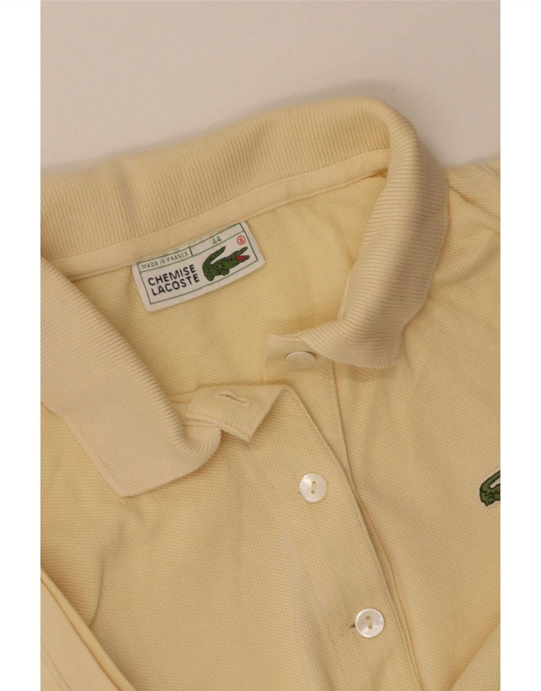 Lacoste Polo sans manches femme taille 44 grand jaune
