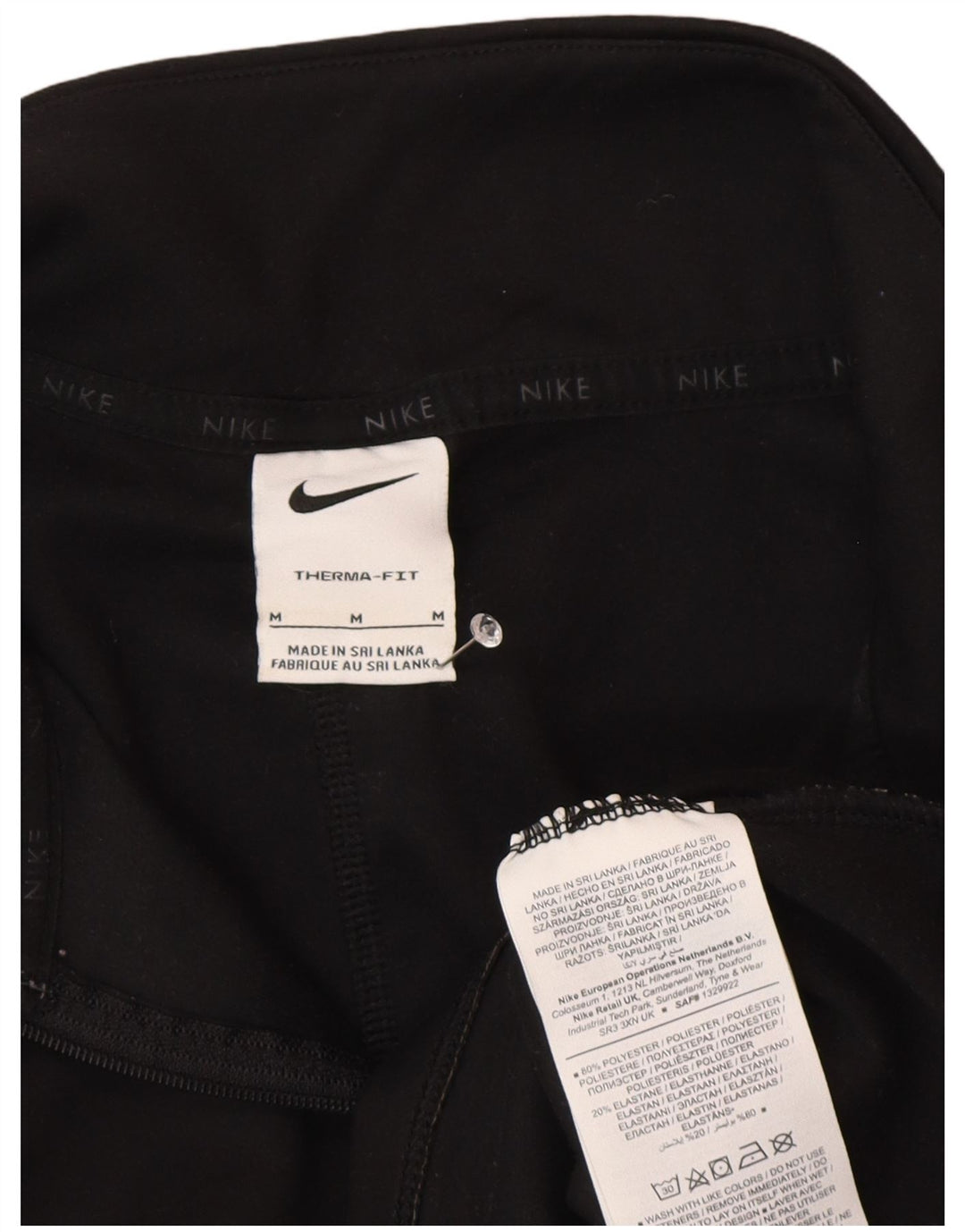 Nike Haut de survêtement à col zippé Therma-Fit pour femme UK 14 Noir moyen