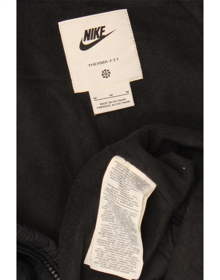 NIKE Veste coupe-vent à capuche Therma-Fit pour homme UK 38 Noir moyen