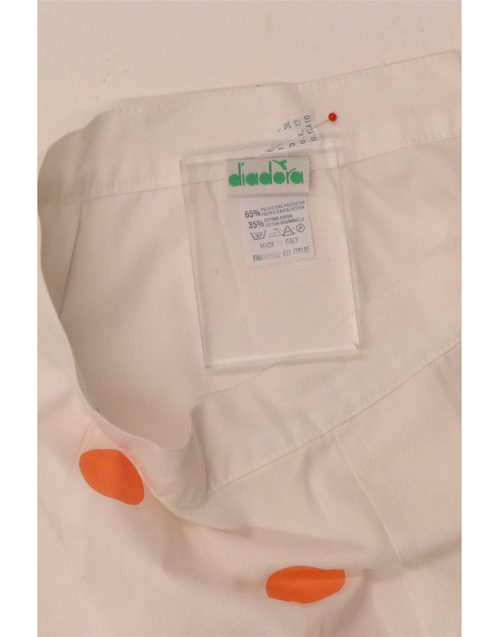 Diadora Mini jupe femme UK 12 Medium W26 blanc à pois en polyester