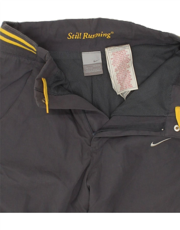 NIKE Boys Graphic Tracksuit Trousers 10-11 Years Medium Grey Polyester Vintage Nike and Second-Hand Nike from Messina Hembry 
