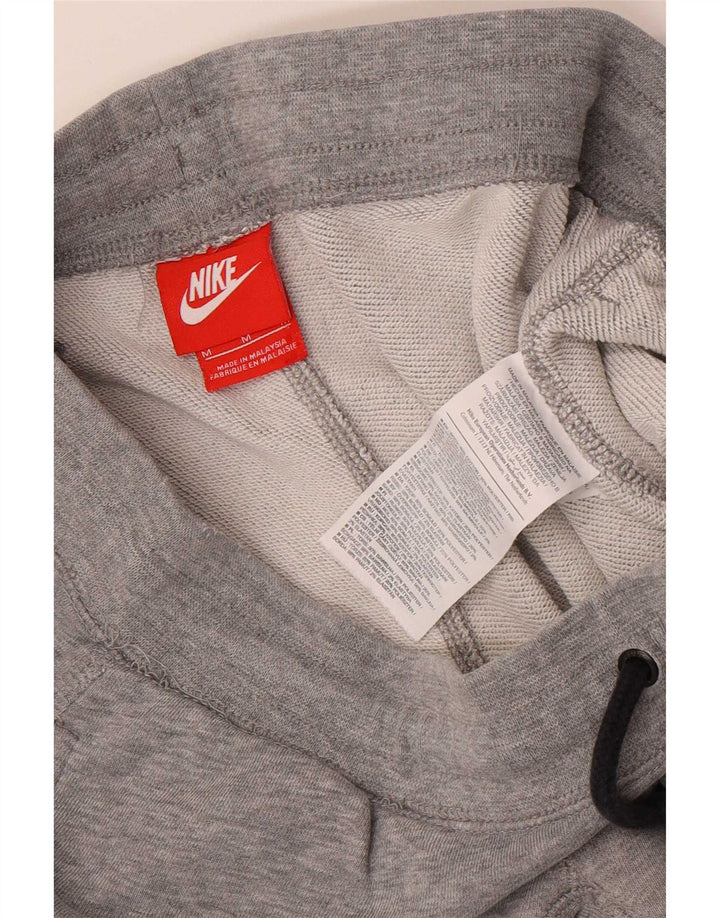Pantalon de survêtement graphique Nike Homme Pantalon de jogging en coton gris moyen