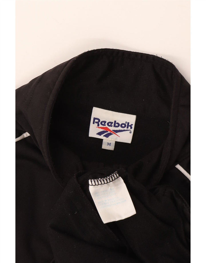 Reebok Veste de Survêtement Graphique à Manches Courtes Homme Noir Moyen