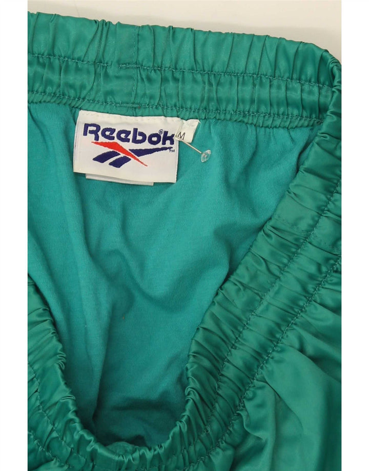 Reebok Short de Sport Homme Vert Moyen Nylon