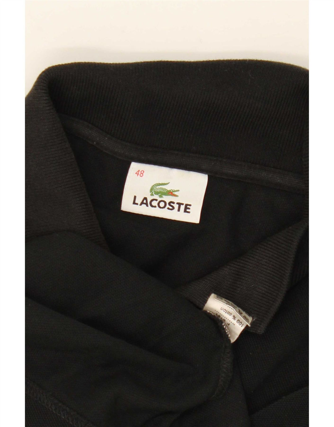 Lacoste Polo sans manches femme taille 48 XL noir