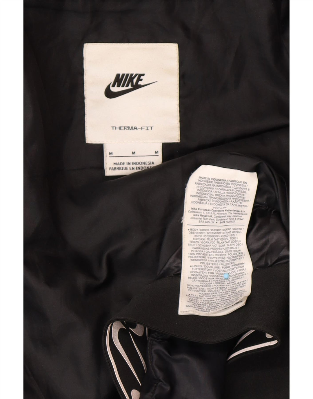 NIKE Veste matelassée à capuche Therma-Fit Graphic pour femme UK 14 Noir moyen