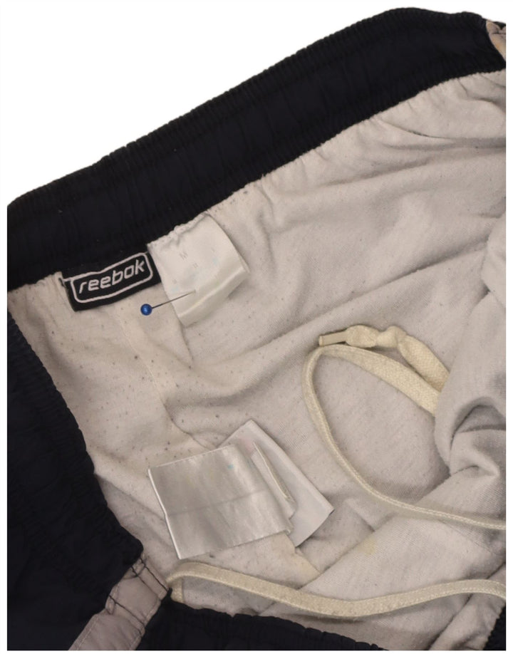 Reebok Pantalon de Survêtement Cargo Homme Bleu Marine Colorblock