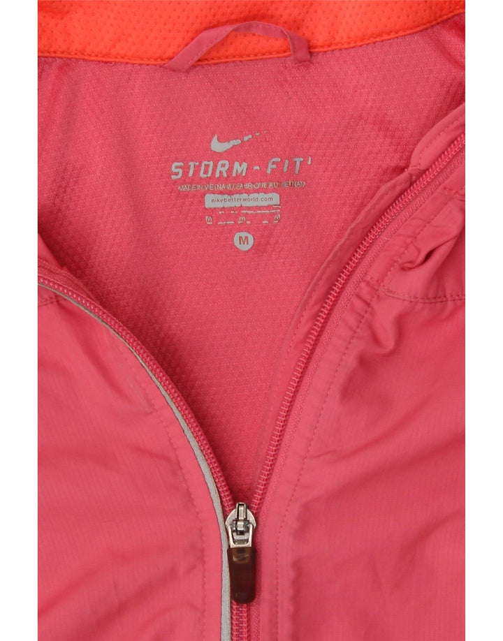 Veste de pluie Nike Storm-Fit pour femme UK 12 Polyester color block rose moyen