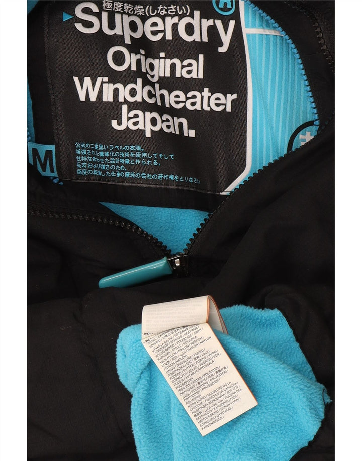 Superdry Veste coupe-vent à capuche Windcheater pour femme UK 14 Medium Noir