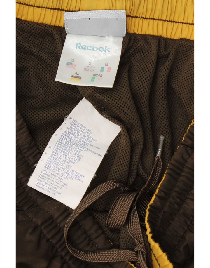 Reebok Pantalon de Survêtement Graphic Homme Joggers Small Marron Polyester
