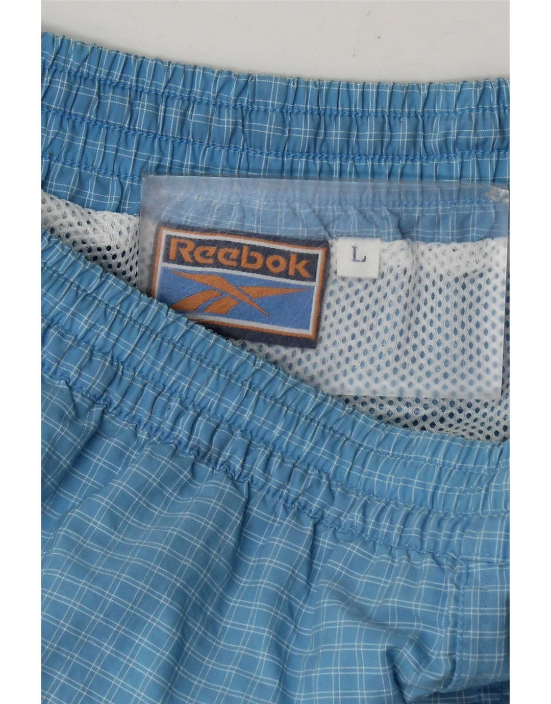 Reebok Short de Sport Homme Grand Carreau Bleu