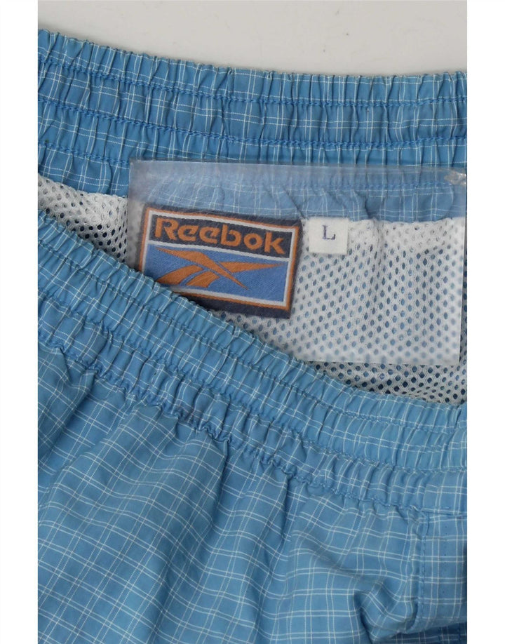Reebok Short de Sport Homme Grand Carreau Bleu