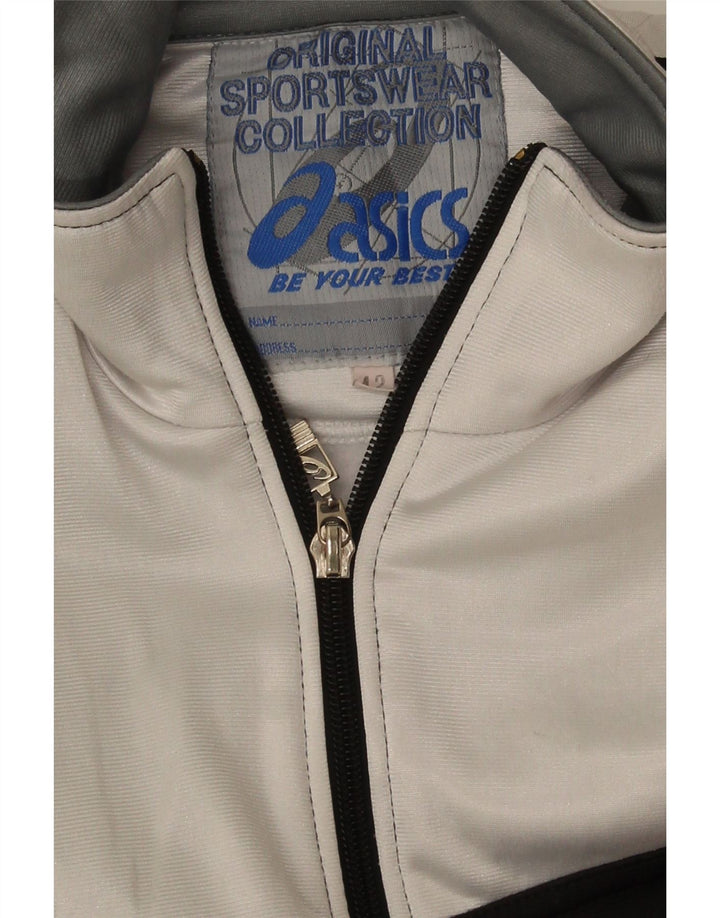 Asics Veste de survêtement graphique pour femme IT 42 Noir moyen Colourblock