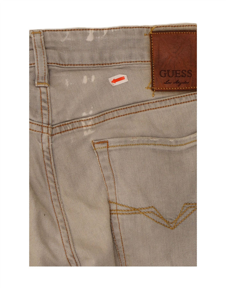 GUESS Jean skinny effet vieilli W32 L32 gris coton