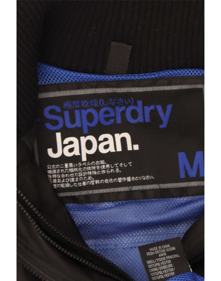 Superdry Veste de pluie graphique pour femme UK 14 Medium Noir