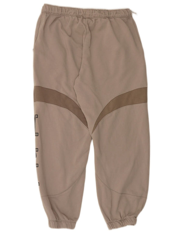 Pantalon de survêtement graphique Nike Homme Pantalon de jogging Beige moyen colour block