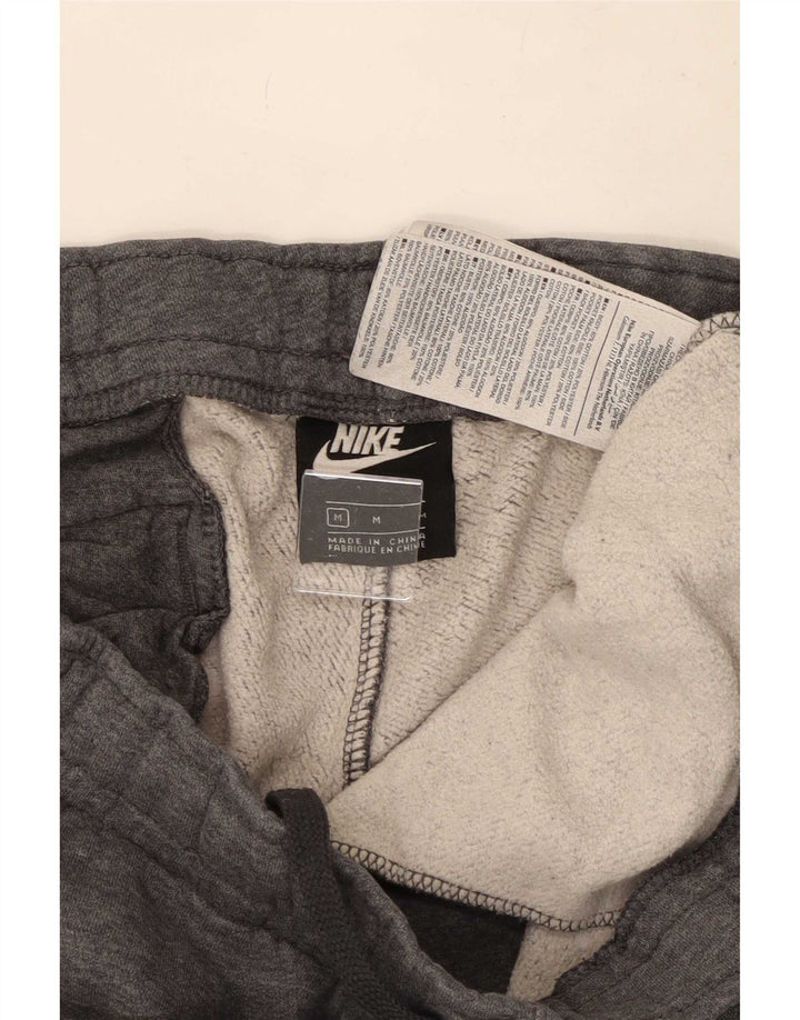 Pantalon de survêtement graphique Nike Homme Pantalon de jogging en coton gris moyen
