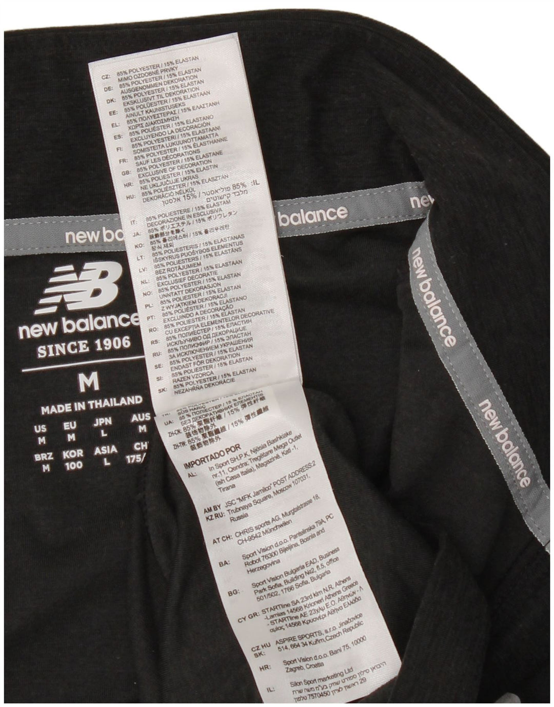 New Balance Haut de Survêtement Zip Neck Homme Noir Moucheté