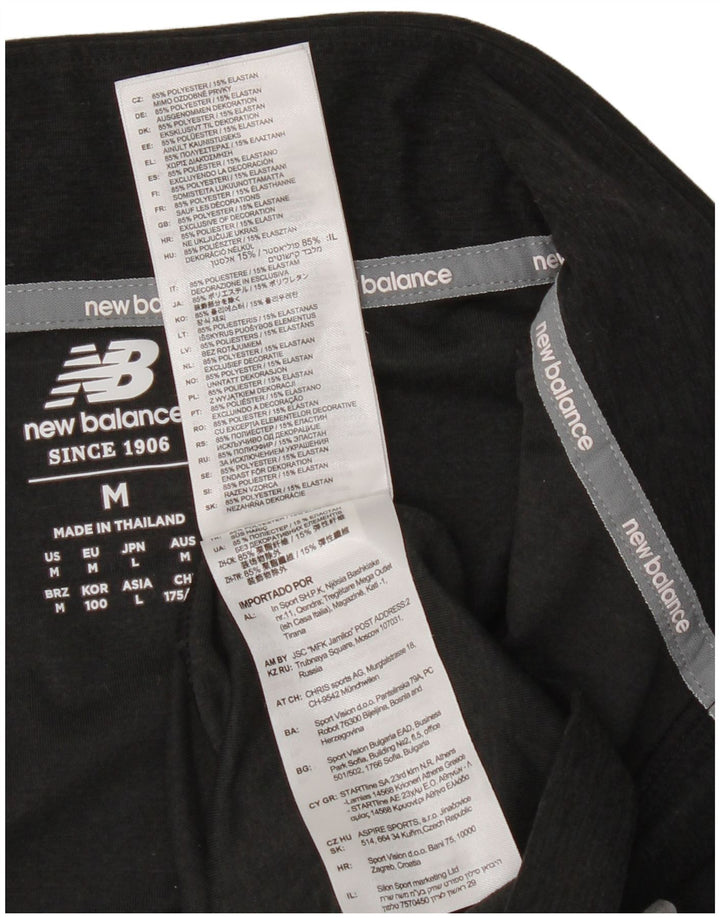New Balance Haut de Survêtement Zip Neck Homme Noir Moucheté