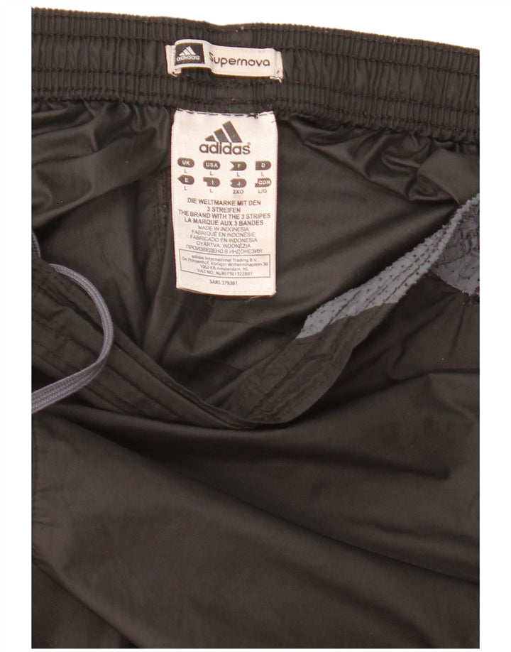 Adidas Pantalon imperméable Supernova pour homme Taille L en polyester color block noir