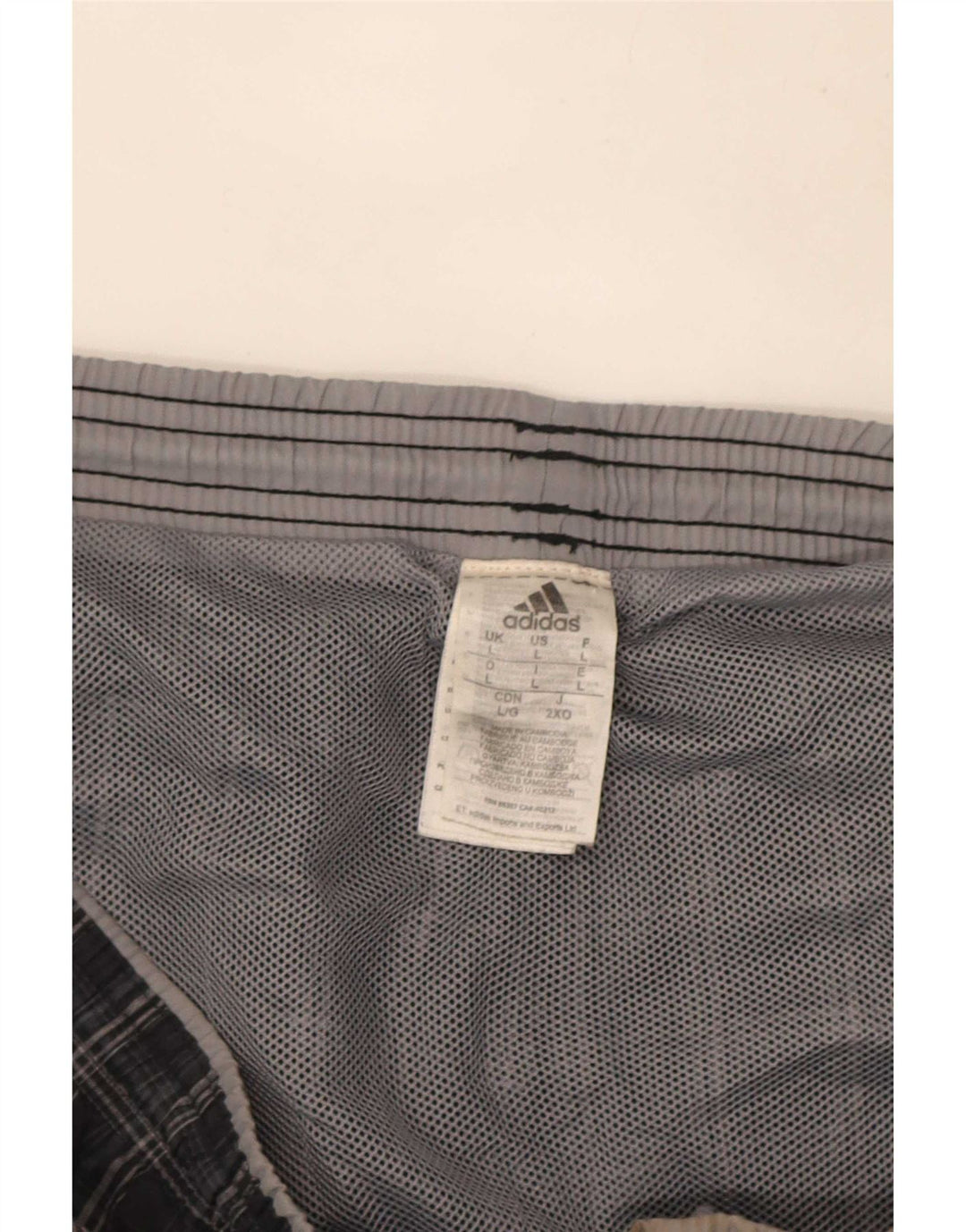 Adidas Short de sport pour homme en polyester à carreaux gris