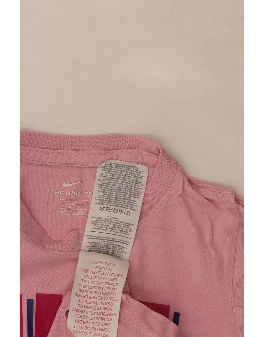 NIKE Girls Graphic T-Shirt Top 6-7 Years XS Pink Cotton Vintage Nike and Second-Hand Nike from Messina Hembry 