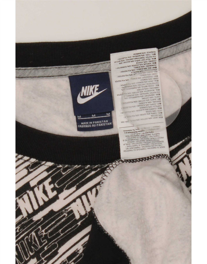Nike Sweat-shirt graphique pour femme UK 14 en coton noir moyen