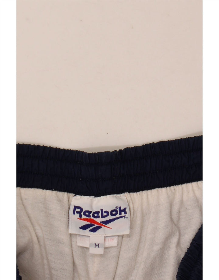 Reebok Pantalon de Survêtement Joggers Homme Bleu Marine Moyen Nylon