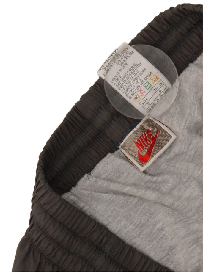 Pantalon de survêtement Nike Homme Pantalon de jogging en nylon gris moyen