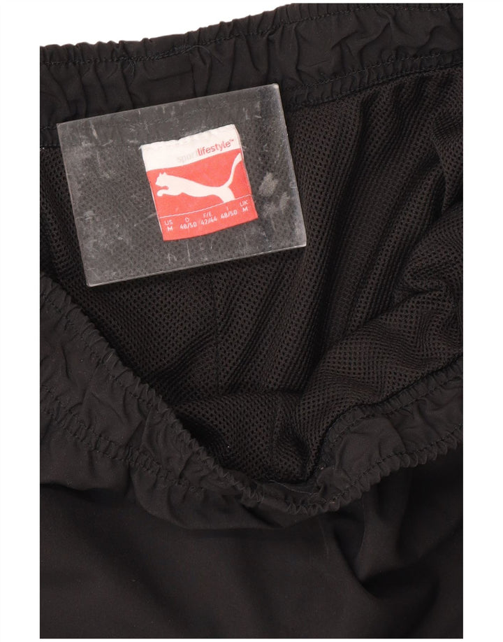 PUMA Pantalon de Survêtement Graphic Capri Homme Noir Moyen