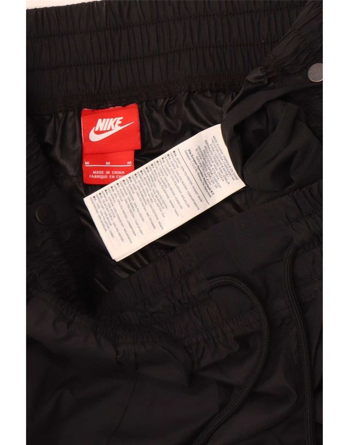 Nike Pantalon de jogging imperméable pour femme UK 12 Medium Noir Polyester