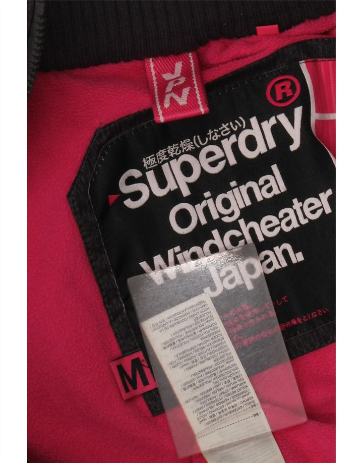 Superdry Veste coupe-vent à capuche Windcheater pour femme UK 14 Medium Noir