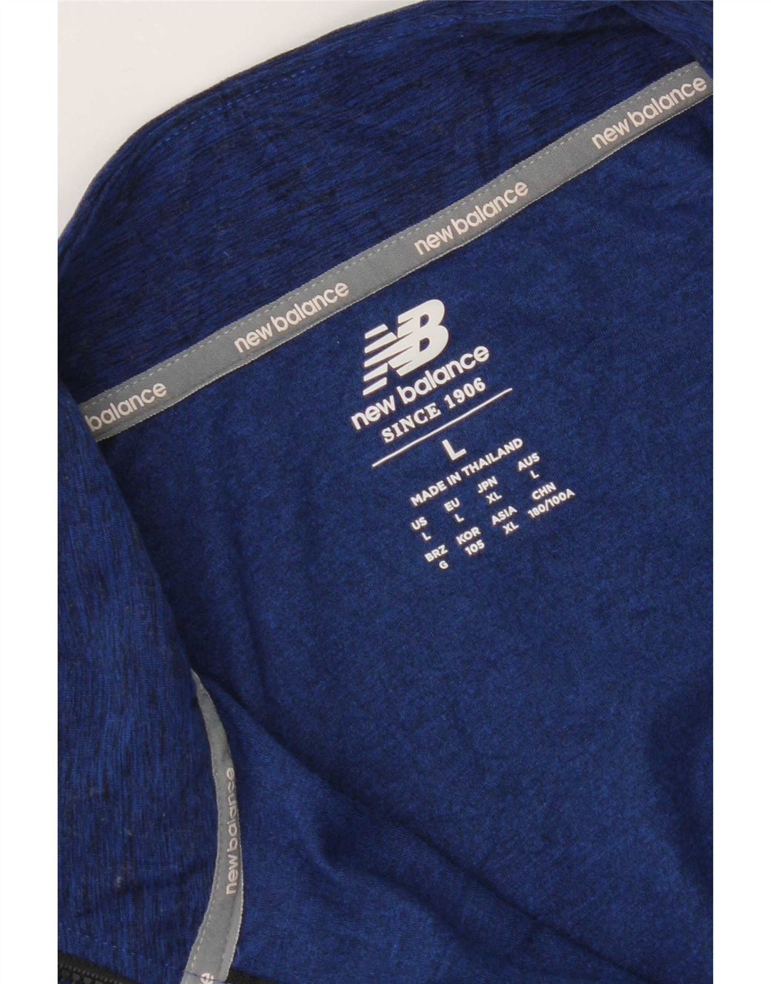 New Balance Haut de survêtement à col zippé pour hommes, grand bleu moucheté