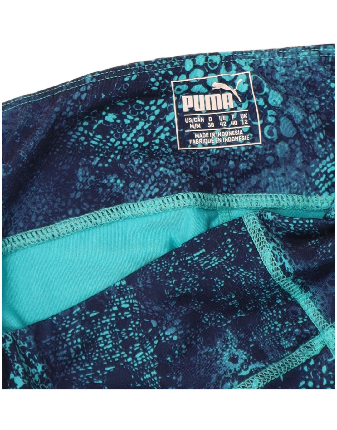 PUMA Legging Capri à motif abstrait pour femme UK 42 Bleu moyen Polyester