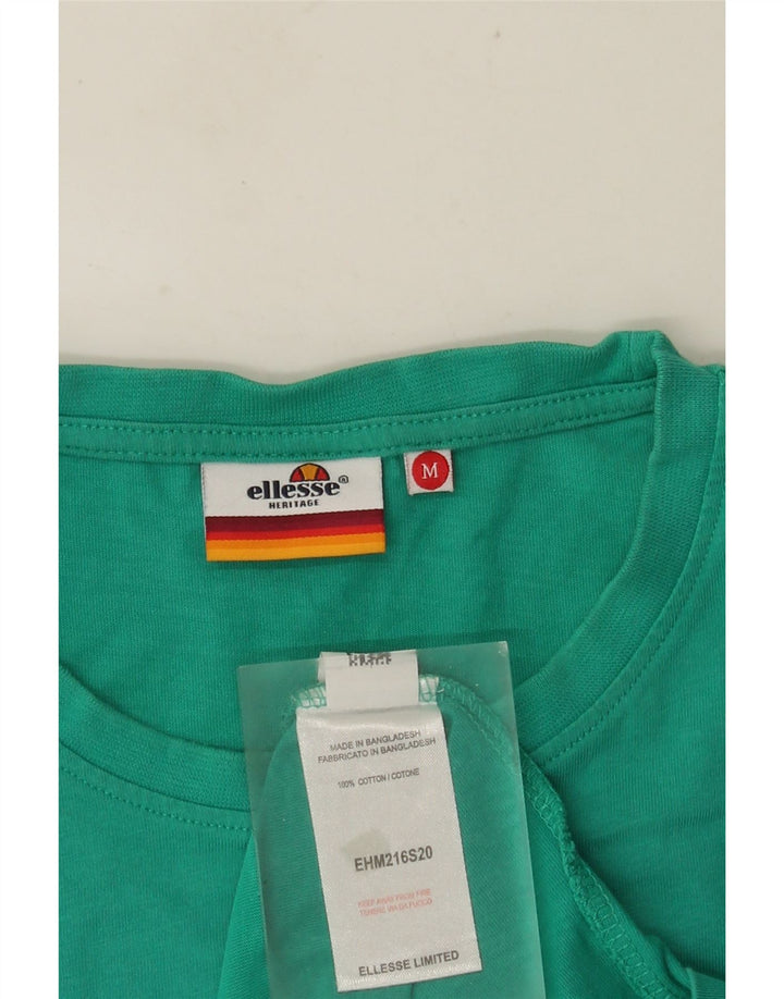 ELLESSE T-Shirt Graphique Heritage Homme Coton Turquoise Moyen