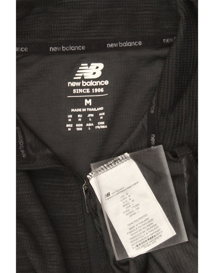 New Balance Haut de Survêtement Zip Neck Pull Homme Noir Moyen Polyester