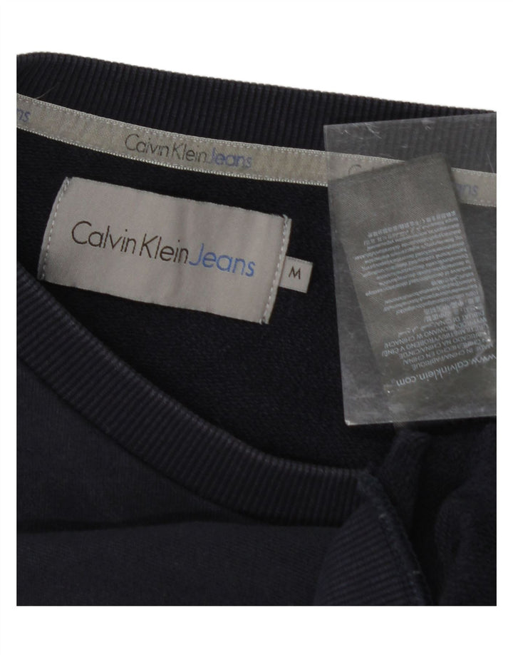 CALVIN KLEIN JEANS Mens Graphic Sweatshirt Jumper Medium Navy Blue Cotton Vintage Calvin Klein Jeans and Second-Hand Calvin Klein Jeans from Messina Hembry 